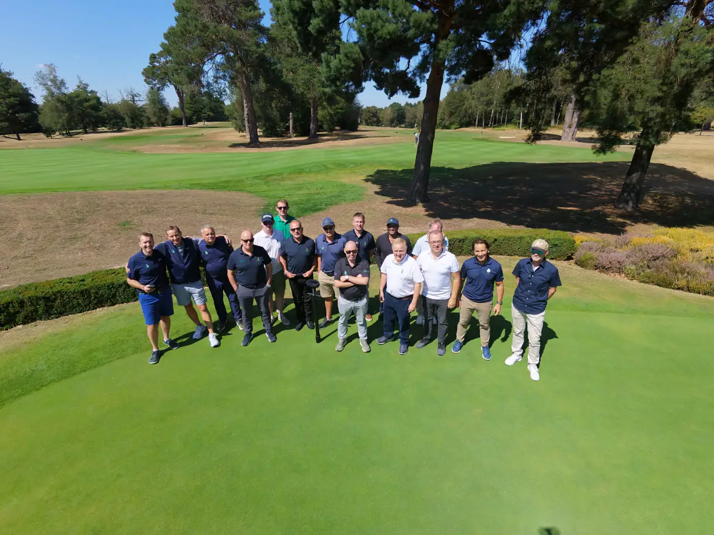 A group of greenkeepers gathered on a green during a PURE Insight demonstration day